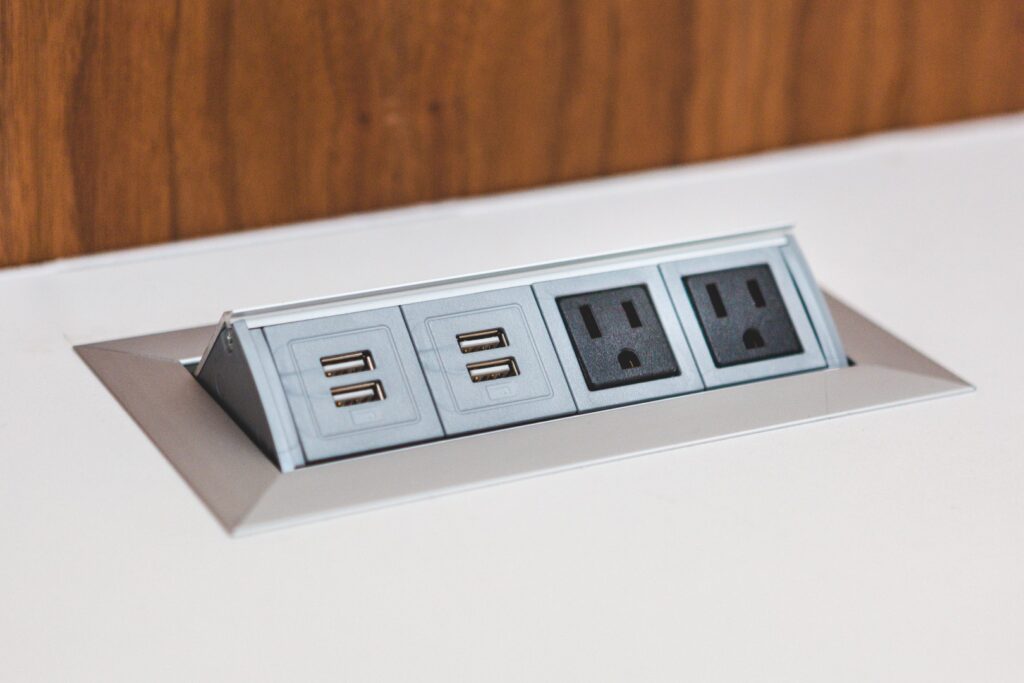 Modern USB charging outlet installed for convenience and safety in a residential living room.