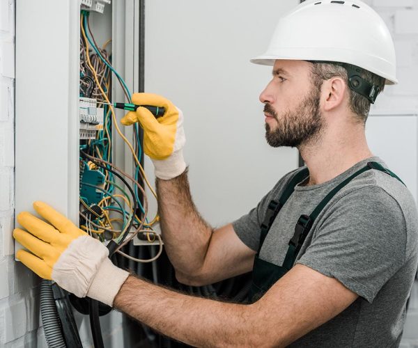 electrician working on electrical box