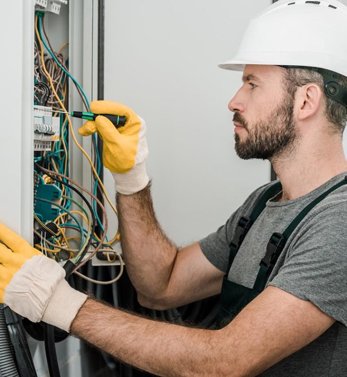 electrician working on electrical box