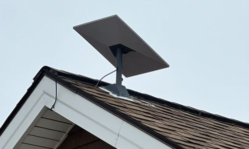 A Starlink mounted on a roof A Starlink mounted on a roof